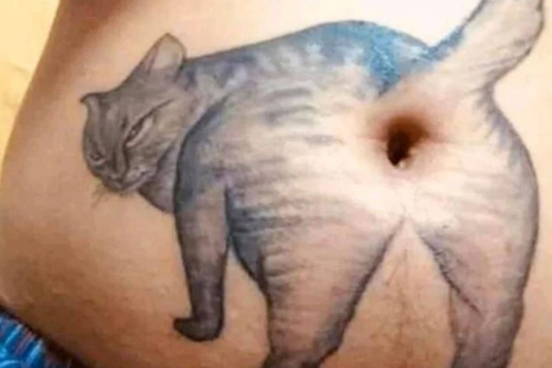 cat belly button tattoo