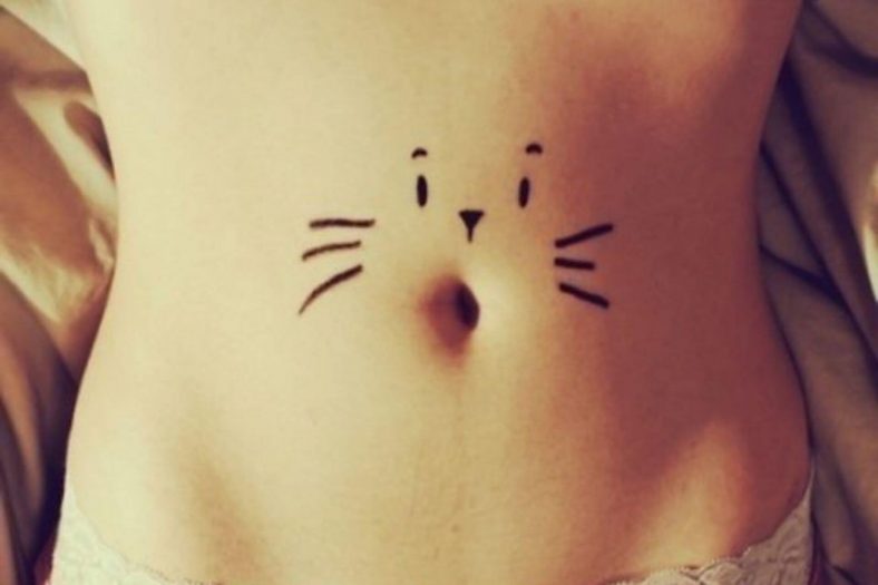 cat belly button tattoo