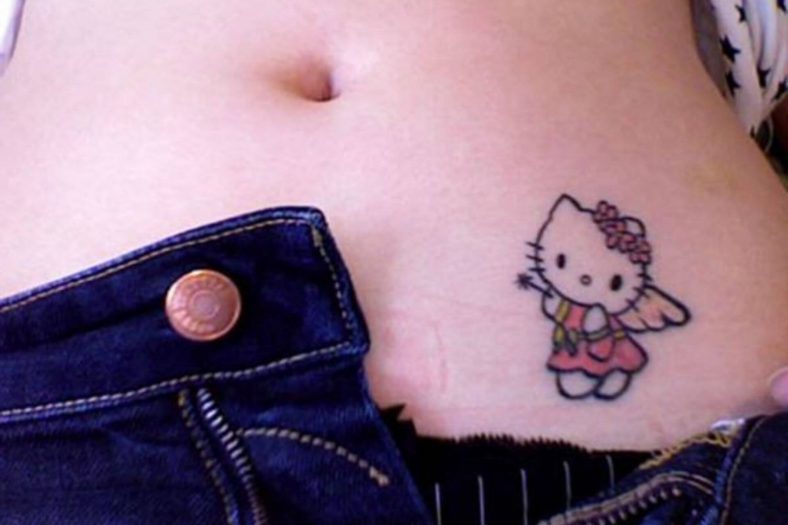 cat belly button tattoo