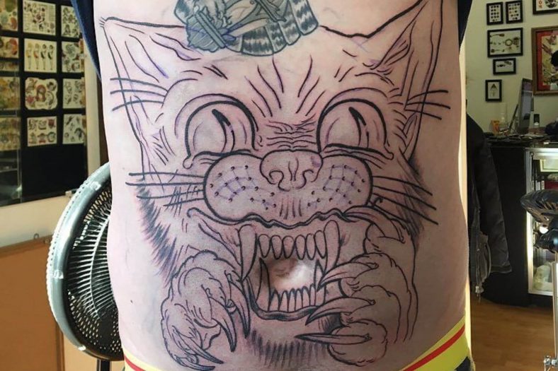 cat belly button tattoo